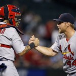 St. Louis Cardinals' Trevor Rosenthal (44) and Yadier Molina celebrate after the final out of a baseball game Wednesday, Aug. 27, 2015, in Phoenix. The Cardinals defeated the Diamondbacks 5-3. (AP Photo/Ross D. Franklin)