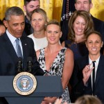 Former Phoenix Mercury guard Diana Taurasi, second from right, reacts as President Barack Obama speaks to her in the East Room of the White House in Washington, Wednesday, Aug. 26, 2015, during a ceremony where the president honored the 2014 WNBA basketball Champions Phoenix Mercury. (AP Photo/Andrew Harnik)