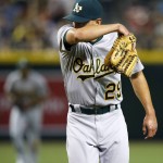 Oakland Athletics' Pat Venditte walks off the field after the final out during the seventh inning of a baseball game, but not before giving up a two-run home run to Arizona Diamondbacks' Paul Goldschmidt, Friday, Aug. 28, 2015, in Phoenix. Arizona won 6-4. (AP Photo/Ross D. Franklin)