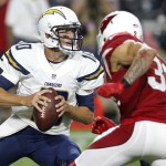 San Diego Chargers quarterback Kellen Clemens looks to pass under pressure from Arizona Cardinals free safety Tyrann Mathieu (32) during the first half of an NFL preseason football game, Saturday, Aug. 22, 2015, in Glendale, Ariz. (AP Photo/Rick Scuteri)