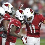 Arizona Cardinals wide receiver John Brown (12) celebrates his touchdown with teammate Larry Fitzgerald (11) during the first half of an NFL preseason football game against the San Diego Chargers, Saturday, Aug. 22, 2015, in Glendale, Ariz. (AP Photo/Rick Scuteri)