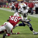 San Diego Chargers running back Branden Oliver (43) scores a touchdown as Arizona Cardinals defensive back Jimmy Legree (46) defends during the first half of an NFL preseason football game, Saturday, Aug. 22, 2015, in Glendale, Ariz. (AP Photo/Rick Scuteri)