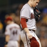 Arizona Diamondbacks starting pitcher Chase Anderson kicks at the mound after Pittsburgh Pirates' Jung Ho Kang hit a single, moving Aramis Ramirez up to second, in the fifth inning of a baseball game, Tuesday, Aug. 18, 2015, in Pittsburgh. Anderson was charged with three runs in the inning and was taken out of the game later. (AP Photo/Keith Srakocic)