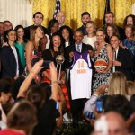 President Barack Obama holds a Phoenix Mercury basketball jersey given to him by the team during a ceremony in the East Room of the White House in Washington, Wednesday, Aug. 26, 2015, where he honored the 2014 WNBA basketball Champions Phoenix Mercury. (AP Photo/Andrew Harnik)