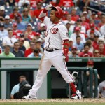 Washington Nationals' Yunel Escobar (5) reacts after his hand was hit by a pitch from the Arizona Diamondbacks in the third inning of a baseball game in Washington, Thursday, Aug. 6, 2015. (AP Photo/Jacquelyn Martin)