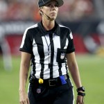Line judge Sarah Thomas waits for play to resume during the first half of an NFL preseason football game between the Arizona Cardinals and the Kansas City Chiefs, Saturday, Aug. 15, 2015, in Glendale, Ariz. (AP Photo/Rick Scuteri)
