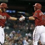 Arizona Diamondbacks' Paul Goldschmidt, right, celebrates his home run with David Peralta, left, during the first inning of a baseball game against the St. Louis Cardinals on Wednesday, Aug. 26, 2015, in Phoenix. (AP Photo/Ross D. Franklin)