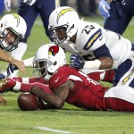 Arizona Cardinals wide receiver John Brown (12) recovers his own fumble as San Diego Chargers' Darrell Stuckey (25) and Nick Dzubnar (48) defend during the first half of an NFL preseason football game, Saturday, Aug. 22, 2015, in Glendale, Ariz. (AP Photo/Ross D. Franklin)
