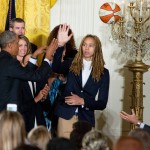 Phoenix Mercury center Brittney Griner, center, pretends to try to block President Barack Obama, left, as he passes a basketball to an aide in the East Room of the White House in Washington, Wednesday, Aug. 26, 2015, during a ceremony honoring the WNBA basketball Champions Phoenix Mercury. (AP Photo/Andrew Harnik)