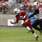 Arizona Cardinals' Patrick Peterson, right, breaks up a pass intended for John Brown during NFL football training camp Thursday, Aug. 13, 2015, in Glendale, Ariz. (AP Photo/Ross D. Franklin)