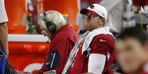 Arizona Cardinals quarterback Carson Palmer sits on the bench during the first half of an NFL prese...