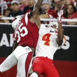 Arizona Cardinals' Cariel Brooks (35) tips the ball away on a pass intended for Kansas City Chiefs' Da'Ron Brown (4) during the first half of an NFL preseason football game Saturday, Aug. 15, 2015, in Glendale, Ariz. (AP Photo/Ross D. Franklin)