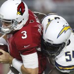 Arizona Cardinals quarterback Carson Palmer (3) is sacked by San Diego Chargers outside linebacker Melvin Ingram (54) during the first half of an NFL preseason football game, Saturday, Aug. 22, 2015, in Glendale, Ariz. (AP Photo/Rick Scuteri)