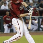 Arizona Diamondbacks' Paul Goldschmidt connects for a triple, scoring Ender Inciarte, during the fifth inning of a baseball game against the Philadelphia Phillies on Wednesday, Aug. 12, 2015, in Phoenix. (AP Photo/Ross D. Franklin)