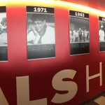 President Michael Bidwill shows off a wall detailing big moments in the franchise's history. (Photo by Paige Dimakos/Arizona Sports)