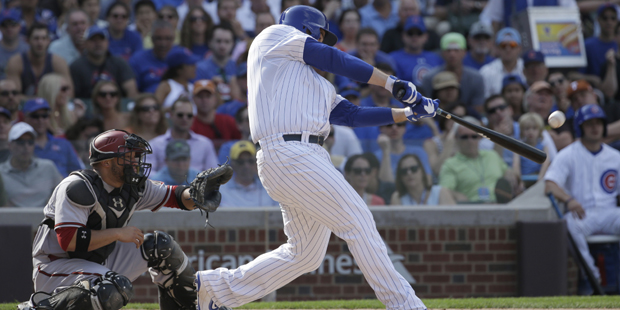 Chicago Cubs' Anthony Rizzo hits a grand slam during the fifth inning of a baseball game against th...