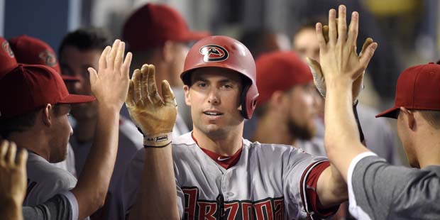 Arizona Diamondbacks' Paul Goldschmidt, right, is congratulated by teammates after hitting a solo h...
