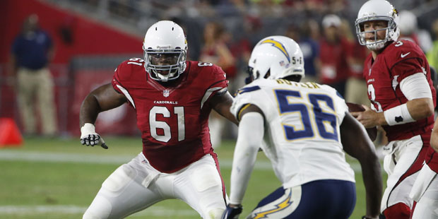 Arizona Cardinals guard Jonathan Cooper (61) lines up against the San Diego Chargers during the fir...