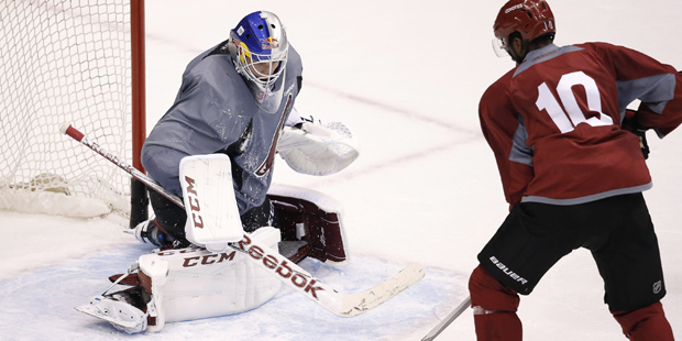 Arizona Coyotes goalie Niklas Treutle makes a save on a shot by Anthony Duclair (10) during the fir...