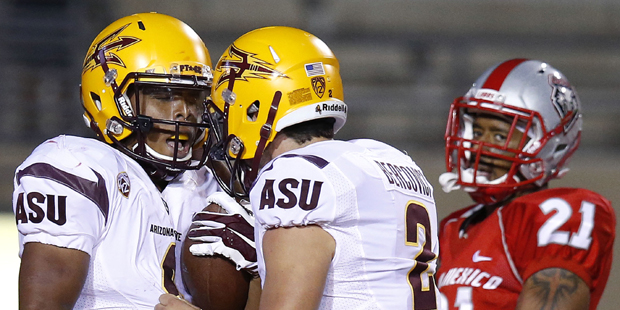 Arizona State's Demario Richard, left, celebrates his touchdown run with Mike Bercovici (2) as New ...