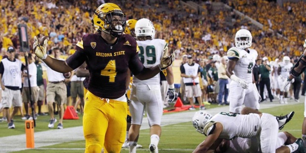 Arizona State's Demario Richard (4) tries to get the crowd going as he celebrates his running touch...