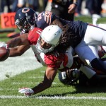 Arizona Cardinals wide receiver Larry Fitzgerald drags Chicago Bears cornerback Terrance Mitchell into the end zone during an NFL football game, Sunday, Sept. 20, 2015 in Chicago. (Steve Lundy/Daily Herald via AP) MANDATORY CREDIT; MAGS OUT