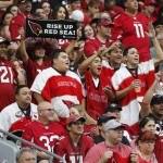 Arizona Cardinals fans cheer during the first half of an NFL football game against the San Francisco 49ers, Sunday, Sept. 27, 2015, in Glendale, Ariz.  (AP Photo/Ross D. Franklin)