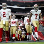 San Francisco 49ers quarterback Colin Kaepernick (7) takes the field with Blaine Gabbert (2) prior to an NFL football game against the Arizona Cardinals, Sunday, Sept. 27, 2015, in Glendale, Ariz.  (AP Photo/Ross D. Franklin)