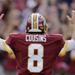 Washington Redskins quarterback Kirk Cousins (8) reacts to running back Matt Jones' touchdown during the second half of an NFL football game against the St. Louis Rams in Landover, Md., Sunday, Sept. 20, 2015. The Redskins defeated the Rams 24-10. (AP Photo/Mark Tenally)