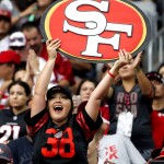 San Francisco 49ers fans cheer during the first half of an NFL football game against the Arizona Cardinals, Sunday, Sept. 27, 2015, in Glendale, Ariz.  (AP Photo/Ross D. Franklin)