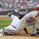 Chicago Cubs' Austin Jackson, left, is forced out at first on a throw from Arizona Diamondbacks right fielder Ender Inciarte to first baseman Paul Goldschmidt, on a fly ball hit by Kris Bryant, during the third inning of a baseball game Saturday, Sept. 5, 2015, in Chicago. (AP Photo/Charles Rex Arbogast)