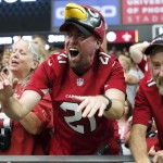 Arizona Cardinals fans cheer during the first half of an NFL football game against the New Orleans Saints, Sunday, Sept. 13, 2015, in Glendale, Ariz. (AP Photo/Ross D. Franklin)