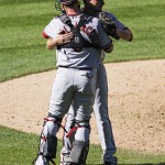 Arizona Diamondbacks relief pitcher Daniel Hudson hugs catcher Jarrod Saltalamacchia, back to camera, after the team's 6-4 victory over the Colorado Rockies during the first game of a baseball doubleheader Tuesday, Sept. 1, 2015, in Denver. (AP Photo/Jack Dempsey)