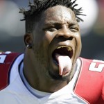 Arizona Cardinals linebacker Sean Weatherspoon (55) sticks out his tongue before an NFL football game against the Chicago Bears, Sunday, Sept. 20, 2015, in Chicago. (AP Photo/Michael Conroy)