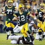 Seattle Seahawks' Bobby Wagner makes a diving try at a scrambling Green Bay Packers' Aaron Rodgers (12) during the first half of an NFL football game Sunday, Sept. 20, 2015, in Green Bay, Wis. (AP Photo/Mike Roemer)
