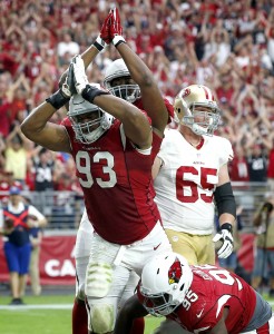 Arizona Cardinals defensive end Calais Campbell (93) signals safety during the second half of an NFL football game against the San Francisco 49ers, Sunday, Sept. 27, 2015, in Glendale, Ariz. (AP Photo/Ross D. Franklin)