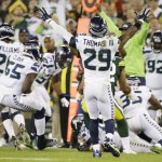 Seattle Seahawks' Earl Thomas celebrates after teammate K.J. Wright recovers a fumble by Green Bay Packers' James Starks (44) during the first half of an NFL football game Sunday, Sept. 20, 2015, in Green Bay, Wis. (AP Photo/Jeffrey Phelps)