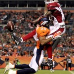 Denver Broncos cornerback Lorenzo Doss (38) breaks up a pass intended for Arizona Cardinals wide receiver Jaron Brown (13) during the first half of an NFL preseason football game, Thursday, Sept. 3, 2015, in Denver. (AP Photo/Joe Mahoney)