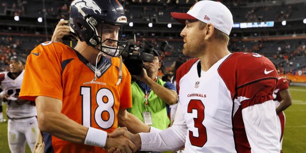 Denver Broncos quarterback Peyton Manning (18) and Arizona Cardinals quarterback Carson Palmer (3) ...