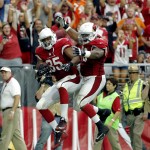 Arizona Cardinals tight end Darren Fells (85) celebrates his touchdown with teammate Earl Watford (78) during the second half of an NFL football game against the New Orleans Saints, Sunday, Sept. 13, 2015, in Glendale, Ariz. (AP Photo/Ross D. Franklin)