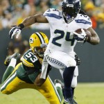 Green Bay Packers' Nick Perry stops Seattle Seahawks' Marshawn Lynch (24) during the first half of an NFL football game Sunday, Sept. 20, 2015, in Green Bay, Wis. (AP Photo/Mike Roemer)