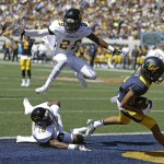 California's Kenny Lawler, right, scores a touchdown past Grambling State's Guy Stallworth (29) and Jordan Stargell (18)  during the first half of an NCAA college football game Saturday, Sept. 5, 2015, in Berkeley, Calif. (AP Photo/Ben Margot)