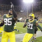 Green Bay Packers' Jayrone Elliott (91) and Datone Jones celebrate during the second half of an NFL football game against the Seattle Seahawks Sunday, Sept. 20, 2015, in Green Bay, Wis. The Packers won 27-17. (AP Photo/Jeffrey Phelps)
