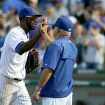 Chicago Cubs center fielder Dexter Fowler, left, celebrates the Cubs' 2-0 win over the Arizona Diamondbacks with manager Joe Maddon, after a baseball game Saturday, Sept. 5, 2015, in Chicago. (AP Photo/Charles Rex Arbogast)