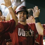 Arizona Diamondbacks' A.J. Pollock is congratulated by teammates in the dugout  after hitting a two run home run against the Colorado Rockies during the seventh inning of the second game of a baseball doubleheader Tuesday, Sept. 1, 2015, in Denver. (AP Photo/Jack Dempsey)