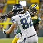 Green Bay Packers' Nate Palmer breaks up a pass intended for Seattle Seahawks' Luke Willson (82) during the second half of an NFL football game Sunday, Sept. 20, 2015, in Green Bay, Wis. (AP Photo/Mike Roemer)