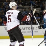 Arizona Coyotes' Connor Murphy (5) celebrates after assisting on a goal by Antoine Vermette, obscured at right, during the second period of an NHL preseason hockey game against the San Jose Sharks on Friday, Sept. 25, 2015, in San Jose, Calif. (AP Photo/Marcio Jose Sanchez)