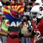 Arizona Cardinals wide receiver John Brown (12) celebrates his touchdown with teammate Larry Fitzgerald (11) during the first half of an NFL football game against the New Orleans Saints, Sunday, Sept. 13, 2015, in Glendale, Ariz. (AP Photo/Rick Scuteri)