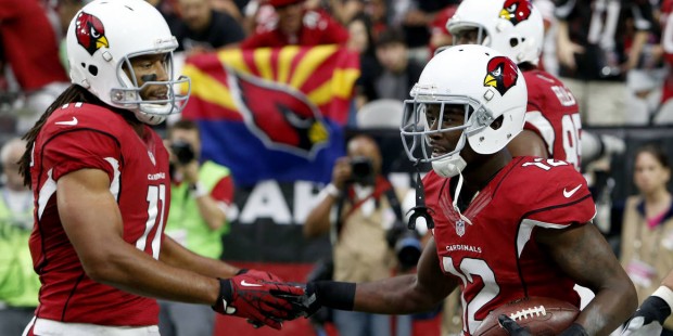 Arizona Cardinals wide receiver John Brown (12) celebrates his touchdown with teammate Larry Fitzge...