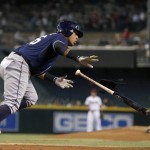 San Diego Padres' Yangervis Solarte, left, tosses his bat away after earning a walk against Arizona Diamondbacks' Jeremy Hellickson, right, during the first inning of a baseball game Monday, Sept. 14, 2015, in Phoenix. (AP Photo/Ross D. Franklin)